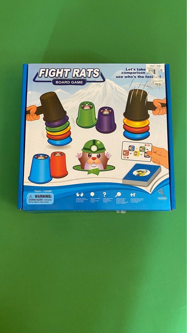 Fight Rats Board Game (Category: Board Games & Puzzles) located in Silang. Submitted by ddeclutterproject (Listing ID 1400634396, Image 1). Description: - Fight Rats board game - For 2 players - Includes cups, hammers, and cards - Objective: Stack cups in the correct order quickly - Box includes components and instructions - Fun and engaging for all ages.