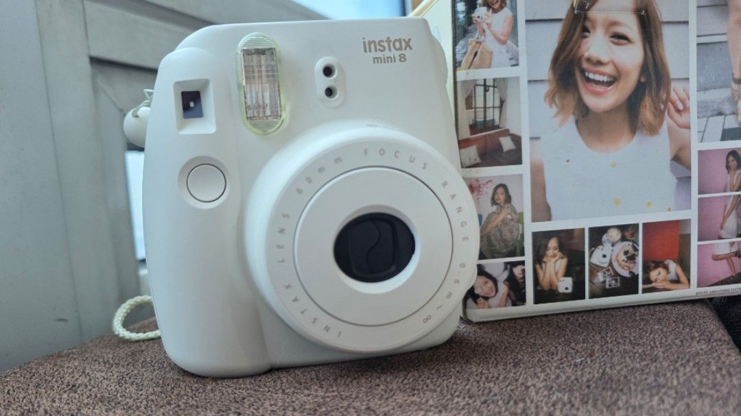 Fujifilm Instax Mini 8 Instant Camera (Category: Cameras) located in Pasay City. Submitted by glc08 (Listing ID 1400653745, Image 2). Description: BRAND NEW IN BOX - Fujifilm Instax Mini 8 instant camera (white) - Includes original box and strap - Built-in flash and lens - Takes instant photos.