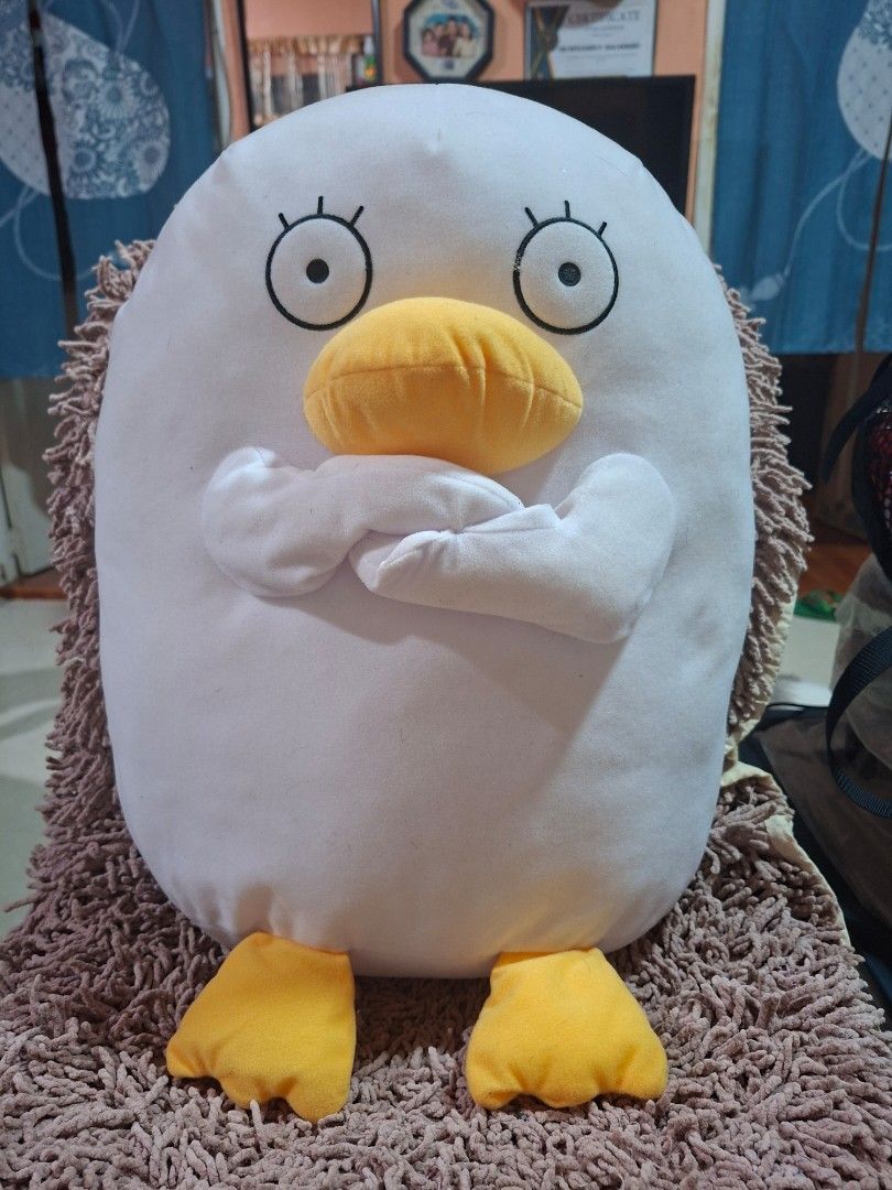 Gintama Duck Plush Pillow (Category: Plushies & Soft Toys) located in Bulacan. Submitted by ourdailyfinds (Listing ID 1400717238, Image 1). Description: Adorable Gintama duck plush pillow. Features a white body with yellow beak and feet. Includes attached tag. Measures approximately 40cm across. Perfect for fans of the anime or anyone looking for a cute and cuddly pillow..