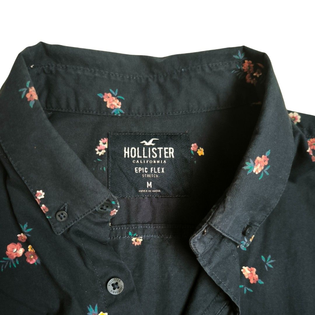Hollister Floral Shirt - Medium (Category: Tshirts & Polo Shirts ) located in Mandaluyong City. Submitted by endal (Listing ID 1400224915, Image 2). Description: - Hollister button-down shirt - Dark navy color with a floral pattern - Long sleeves and a collared neckline - Buttoned cuff - Medium size - Made with Epic Flex fabric - Perfect for casual wear.