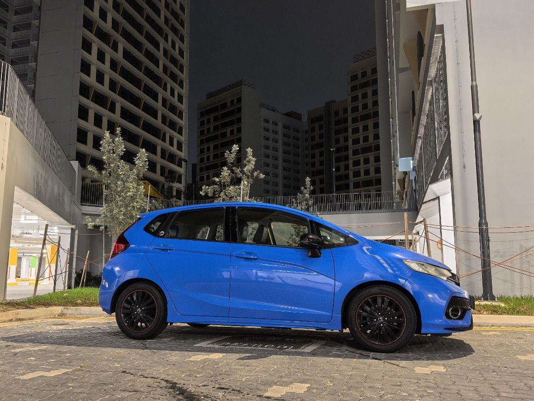 Honda Jazz 1.5 RS (M) (Category: Used Cars) located in Singapore. Submitted by bobthe11th (Listing ID 1368429899, Image 2). Description: rare manual gk5. even rarer Boost Blue FL5 paintwork! 6 speed gearbox. road tax paid till Aug 2026. good fuel consumption, easy to drive, 3/4 tank 500km. Cruise control, keyless entry, push start button. service every 10k with Motul engine oil. wear and tear done: shock absorber, steering rack, clutch, front con