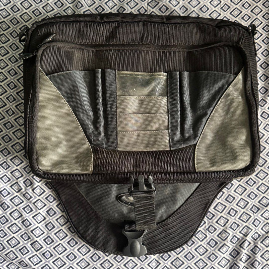 Laptop Bag with Multiple Compartments (Category: Laptop Bags & Sleeves) located in Manila. Submitted by adampadua (Listing ID 1400664951, Image 3). Description: Laptop messenger/sling bag. US Luggage brand. Can fit 15in laptop. Has a lot of pockets and compartments. Good for traveling since the back has a luggage handle slit. Used once. Not really my style. 💰Payment: GCash, Maya, or Bank Transfer (BPI, Metrobank, or Unionbank) 📦Shipping/ Delive