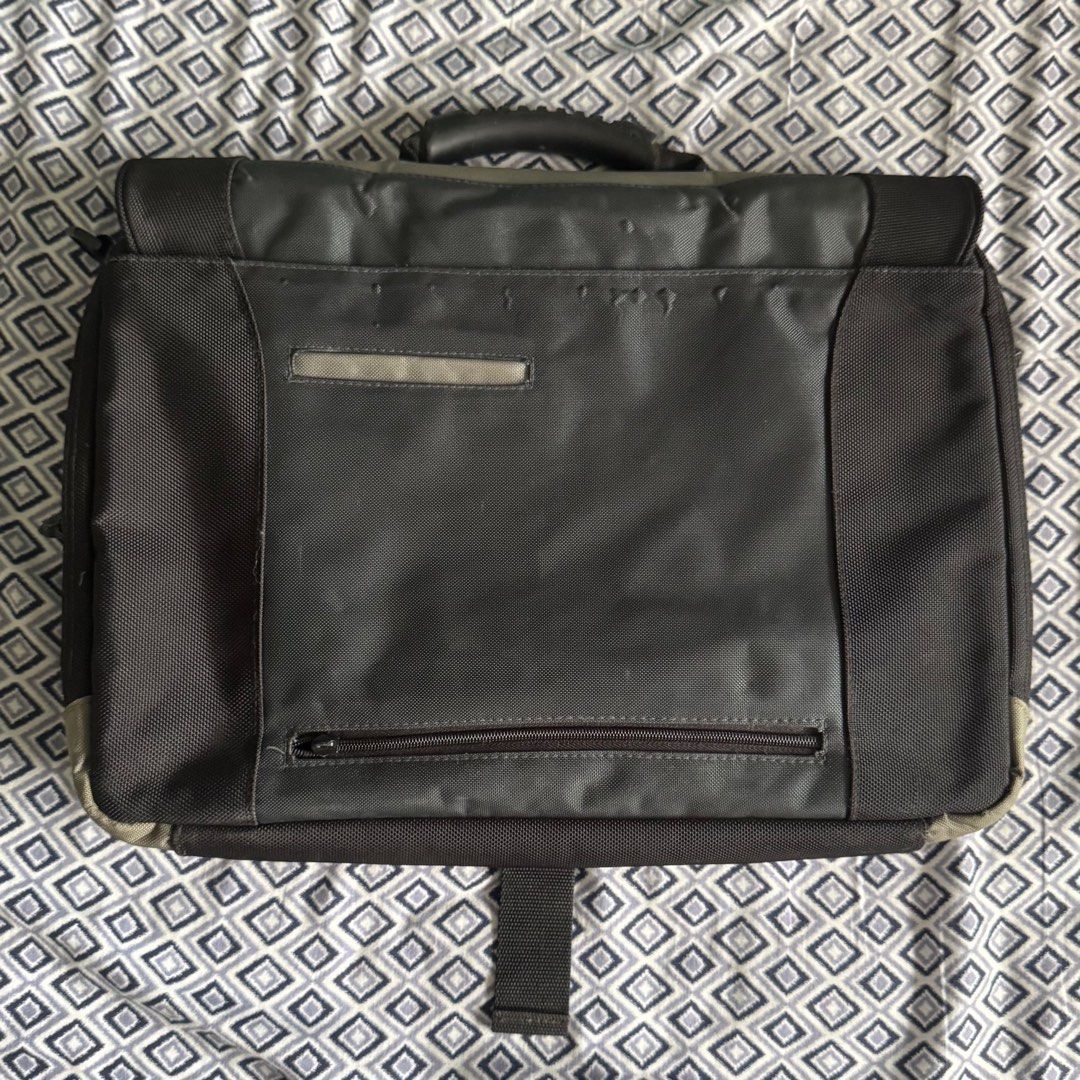 Laptop Bag with Multiple Compartments (Category: Laptop Bags & Sleeves) located in Manila. Submitted by adampadua (Listing ID 1400664951, Image 2). Description: Laptop messenger/sling bag. US Luggage brand. Can fit 15in laptop. Has a lot of pockets and compartments. Good for traveling since the back has a luggage handle slit. Used once. Not really my style. 💰Payment: GCash, Maya, or Bank Transfer (BPI, Metrobank, or Unionbank) 📦Shipping/ Delive