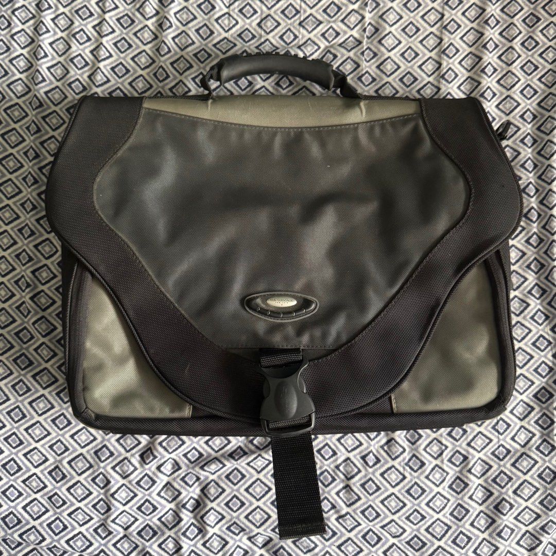 Laptop Bag with Multiple Compartments (Category: Laptop Bags & Sleeves) located in Manila. Submitted by adampadua (Listing ID 1400664951, Image 1). Description: Laptop messenger/sling bag. US Luggage brand. Can fit 15in laptop. Has a lot of pockets and compartments. Good for traveling since the back has a luggage handle slit. Used once. Not really my style. 💰Payment: GCash, Maya, or Bank Transfer (BPI, Metrobank, or Unionbank) 📦Shipping/ Delive