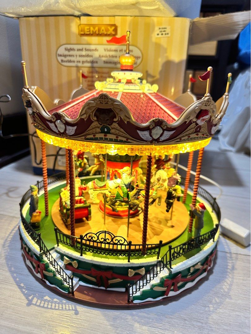 Lemax Australia Santa Carousel - Minor Damage (Category: Vintage Collectibles) located in Taguig. Submitted by heytreasure (Listing ID 1400636957, Image 1). Description: For METRO MANILA ONLY. I can’t ship this provincial because it is very very fragile. LAST UNIT. Authentic Lemax Australia Santa Carousel. This sells for ₱9950 in Rustan’s (see last photo) READ: - lights all work - movement works. Carousel spins - music works Damage: - two flags a