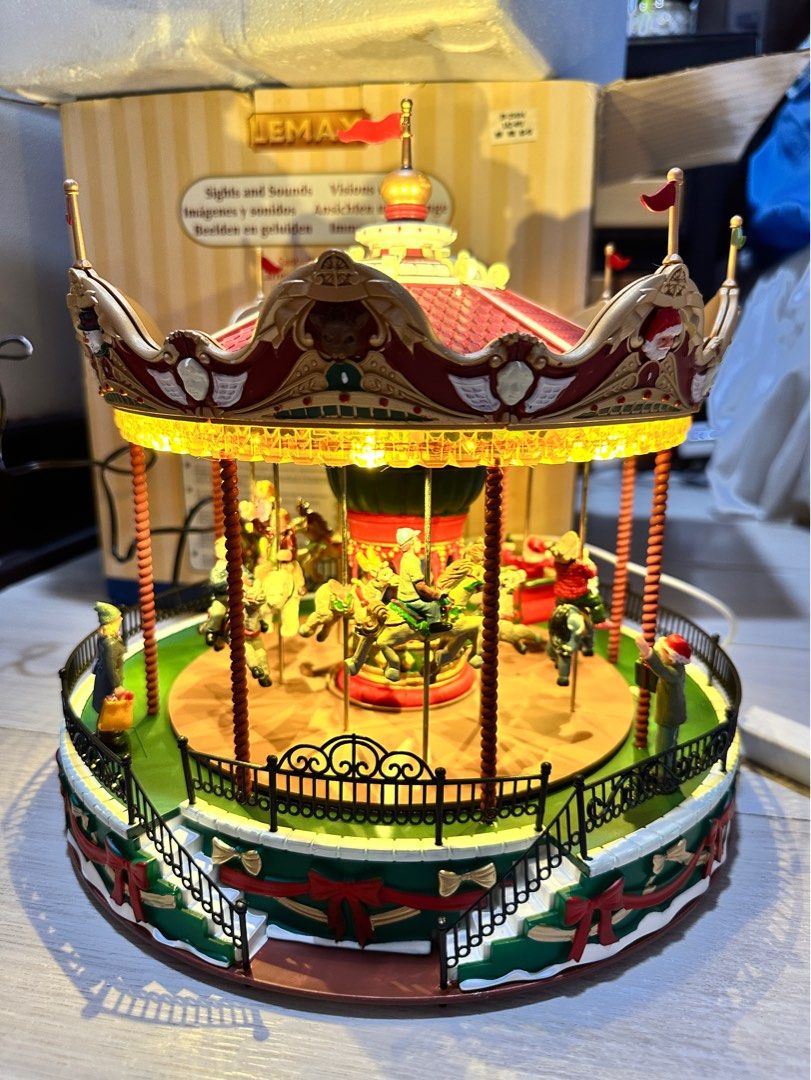 Lemax Australia Santa Carousel - Minor Damage (Category: Vintage Collectibles) located in Taguig. Submitted by heytreasure (Listing ID 1400636957, Image 3). Description: For METRO MANILA ONLY. I can’t ship this provincial because it is very very fragile. LAST UNIT. Authentic Lemax Australia Santa Carousel. This sells for ₱9950 in Rustan’s (see last photo) READ: - lights all work - movement works. Carousel spins - music works Damage: - two flags a