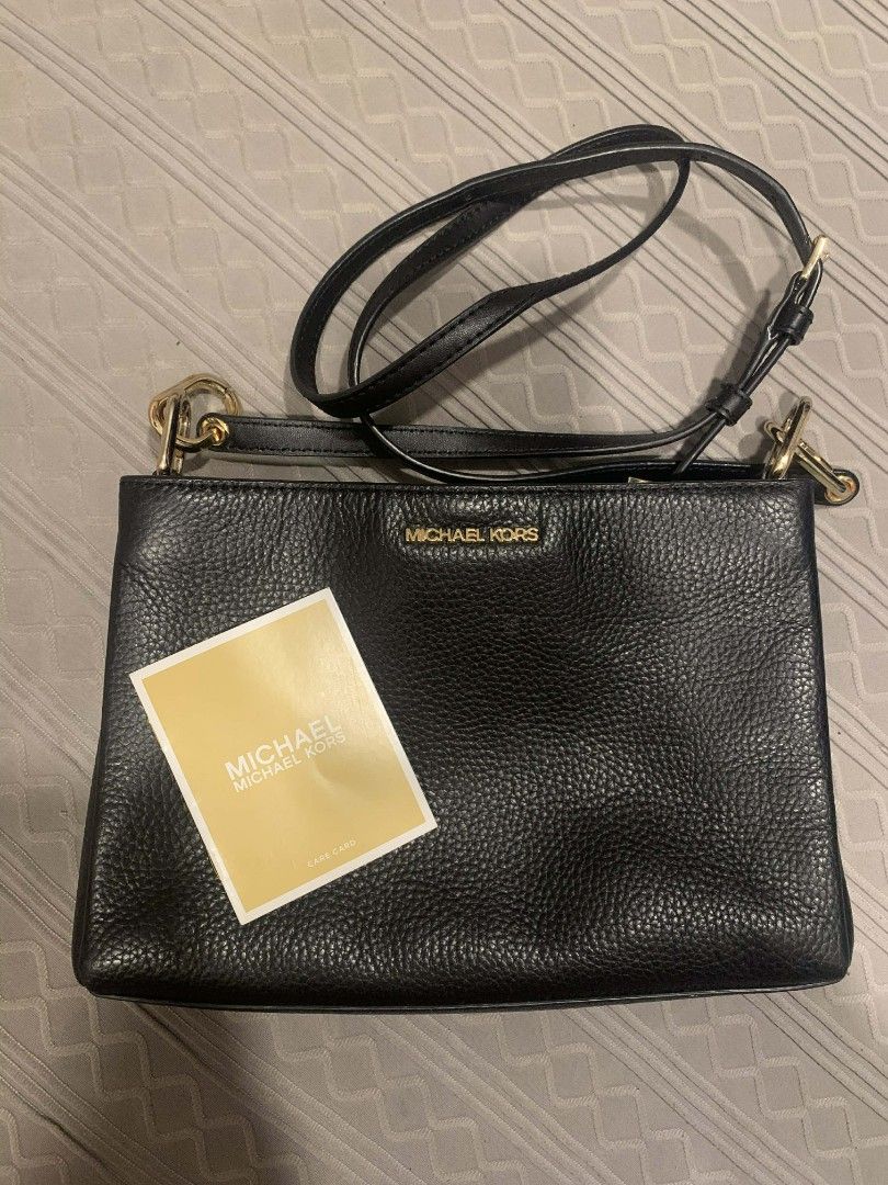 Michael Kors Crossbody Bag (Category: Cross-body Bags) located in Valenzuela. Submitted by trislndgn (Listing ID 1400591483, Image 1). Description: MICHAEL KORS TRISHA TRIPLE COMPARTMENT LIKE NEW BLACK-LEATHER USED THRICE, EVERY OCCASION ONLY CARE CARD NO PAPER BAG LALAMOVE READY/J&T OUTSIDE METRO MANILA.