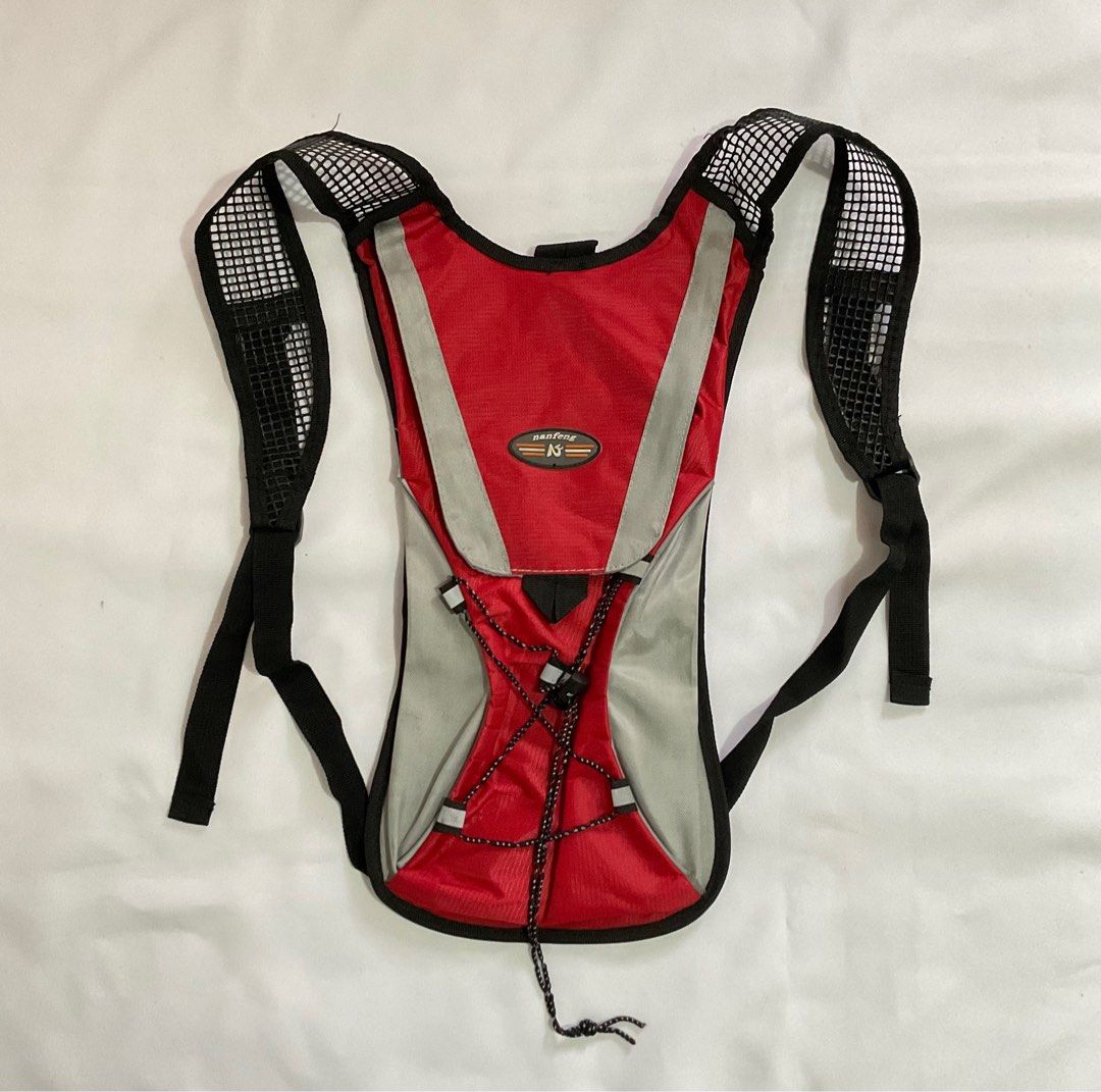 Nanfeng Airflow Hydration Backpack Vest In Red & Grey (No Bladder) (Category: Accessory Holder, Box & Organizers) located in Caloocan City. Submitted by de_clothur (Listing ID 1400589665, Image 1). Description: - condition: 7/10 - kinda old - no more other parts included (no bladder) - holds 2L water - has another pocket for personal items - see ties condition .
