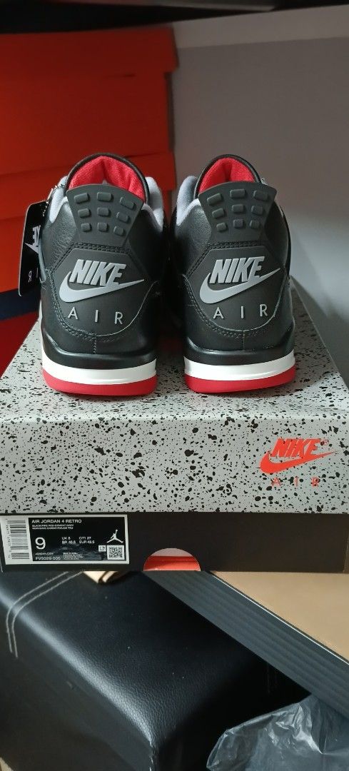 Nike Air Jordan 4 Bred (Category: Sneakers) located in Las Pinas. Submitted by eFF01 (Listing ID 1400751402, Image 3). Description: - Nike Air Jordan 4 Bred sneakers - Size 9 - Includes original box and tag - Colorway: Black, red, and grey - Features a black upper with grey accents and a red outsole - Nike Air logo on the heel.