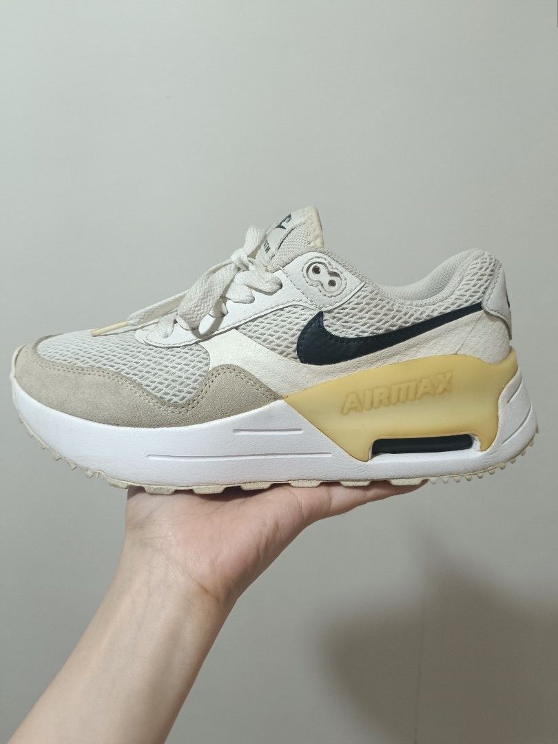 Nike Air Max SYSTM Sneakers (Category: Sneakers) located in Quezon City. Submitted by cutietoothless (Listing ID 1400609224, Image 2). Description: -Used only 3 times because the shoes are a bit tight. As you can see in the picture, there are some dirt marks, but once washed, they’ll look much cleaner. - Nike Air Max SYSTM sneakers - Color: White and Beige - Size: US 7 - Mesh upper - Visible Air Max unit - Lace-up closure - Padded collar - Red in