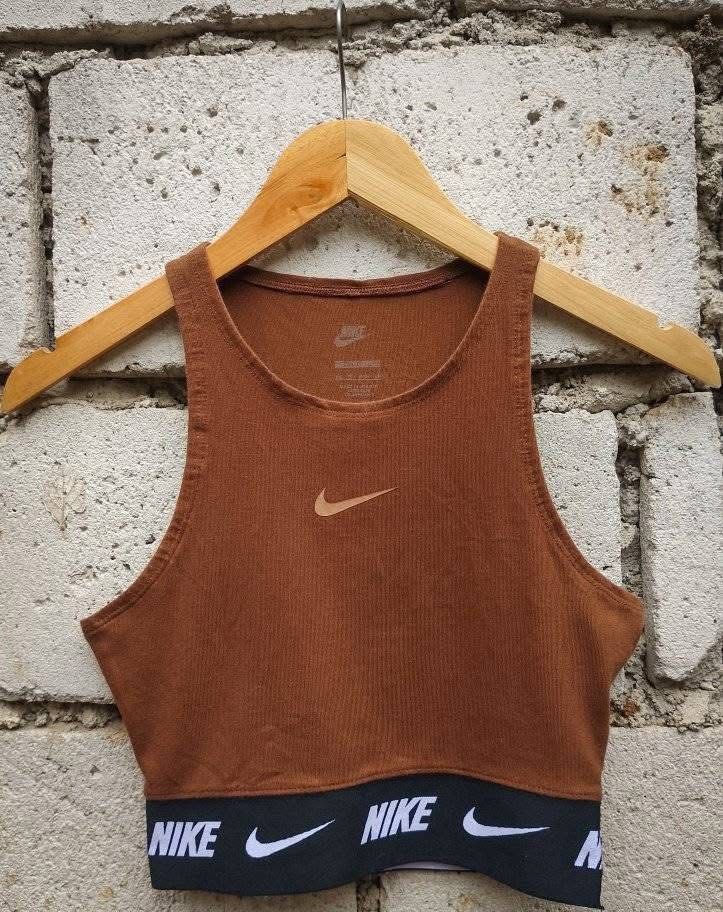 Nike Sportswear Repeat Tape Croptop (Category: Others Tops) located in Manila. Submitted by mayyyyyx (Listing ID 1400593559, Image 2). Description: Nike Sportswear Repeat Tape Crop Top 14W× 15.5L (stretchy material).