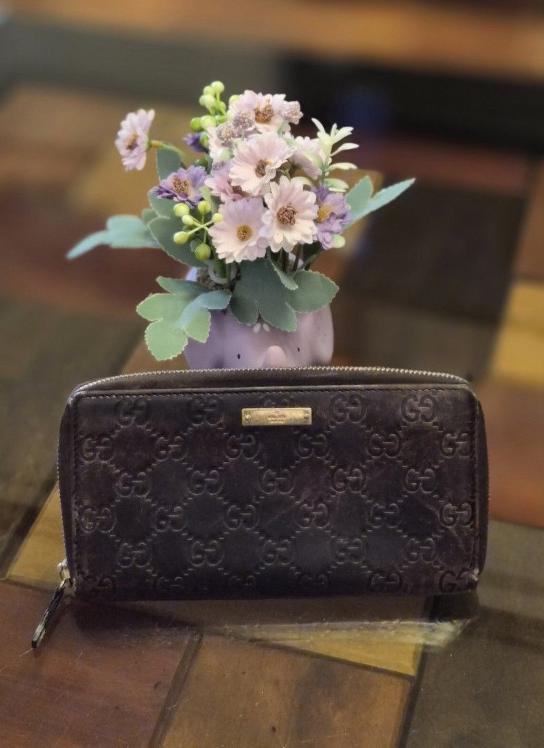 Original Gucci Guccissima Zip Around Wallet (Category: Luxury Bags & Wallets) located in Cabanatuan. Submitted by meyrasol (Listing ID 1400637348, Image 1). Description: actual color is chocolate brown faded leather has visible corner wears.