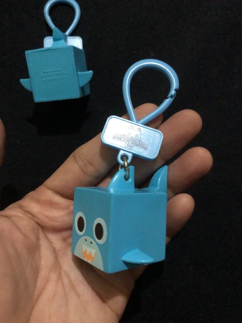 Pet Simulator X cube shark figure charms (Category: Designer & Blind Box Toys) located in Quezon City. Submitted by markgolveo (Listing ID 1400673379, Image 2). Description: Pet Simulator X cube shark figure charms.