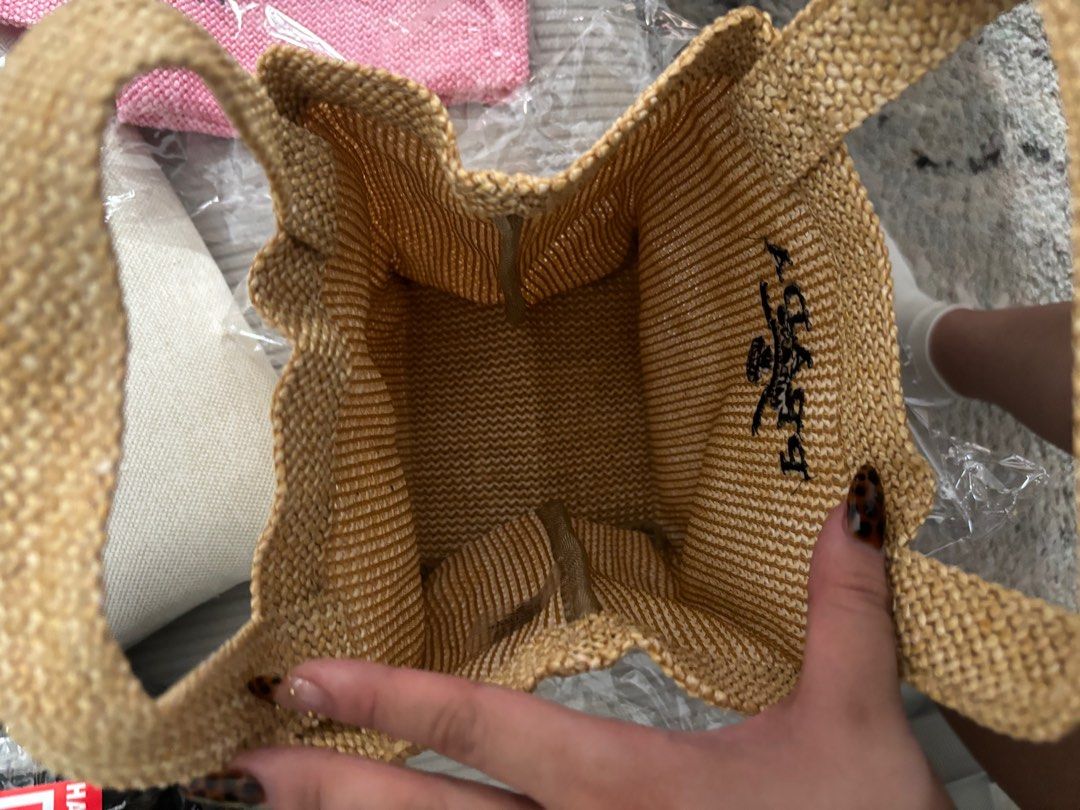 Pr4da GWP small rattan bag (Category: Luxury Bags & Wallets) located in Pasay City. Submitted by _justjoules (Listing ID 1400588044, Image 3). Description: Perfect for errands Authentic GWP As is • No inclusions FB Group: Lux Bargain PH Can be picked up or J&T if outside MM Few stocks left • Fast moving Actual photo ko po yan mismo .