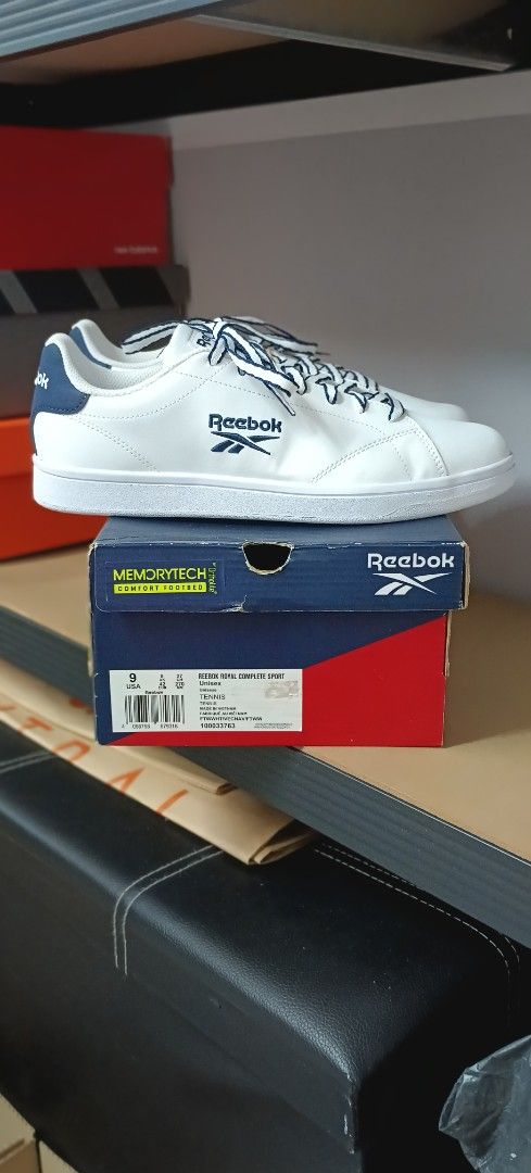 Reebok Club MEMORYTECH Sneakers (Category: Sneakers) located in Las Pinas. Submitted by eFF01 (Listing ID 1400774348, Image 2). Description: - Reebok Club MEMORYTECH sneakers - Color: White with navy blue accents - Features Reebok logo - Includes original box - Size: 9 - White laces with navy blue accents.