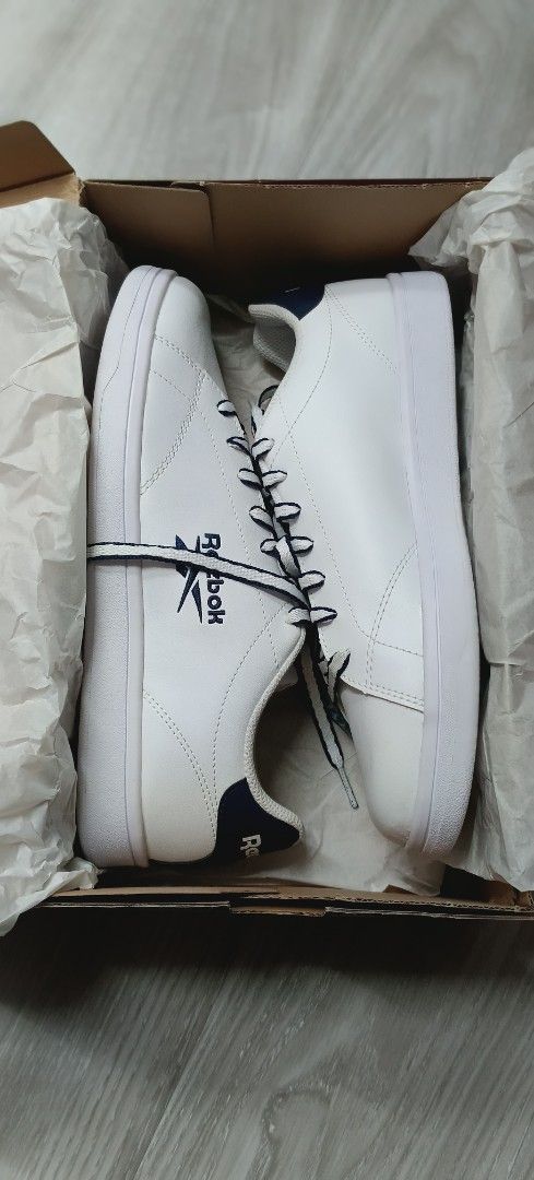 Reebok Club MEMORYTECH Sneakers (Category: Sneakers) located in Las Pinas. Submitted by eFF01 (Listing ID 1400774348, Image 3). Description: - Reebok Club MEMORYTECH sneakers - Color: White with navy blue accents - Features Reebok logo - Includes original box - Size: 9 - White laces with navy blue accents.
