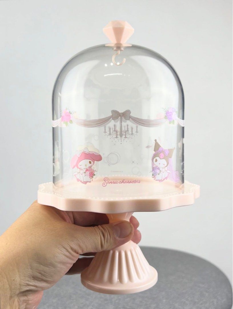 Sanrio Display Case (Category: Designer & Blind Box Toys) located in Manila. Submitted by CPtoysandcollectibles (Listing ID 1400589022, Image 3). Description: Sanrio Oshi Wedding Doll Case by FuRyu •A collectible display case made to showcase your favorite oshi (Sanrio character) in their wedding-themed look. •Perfect for displaying and protecting Sanrio figures or mini plushies. • Diameter: 25 cm • Height: 16 cm (Lid: 16 cm | Base: 9 cm) • Mater