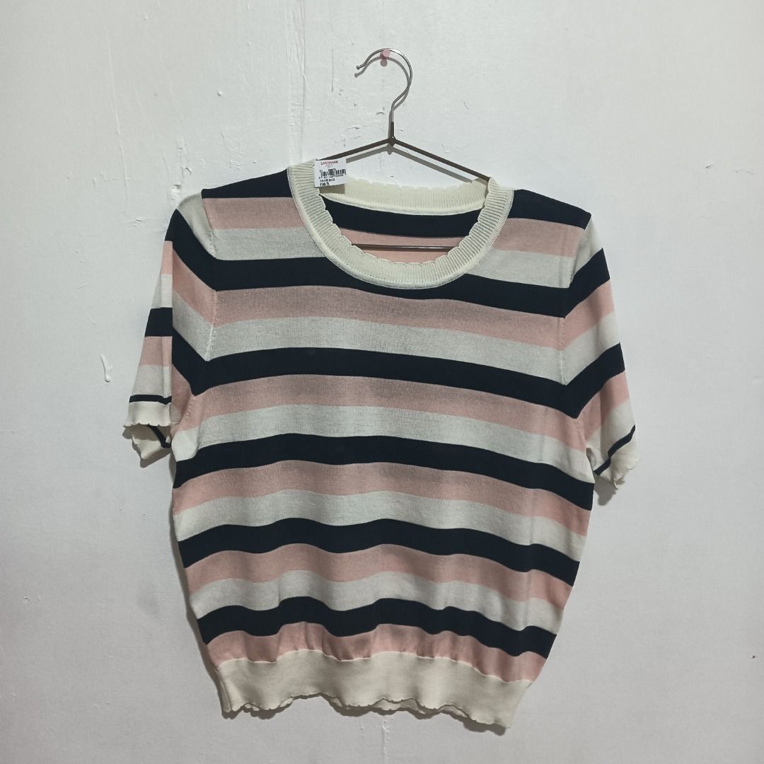 Striped Knit Top (Category: Blouses) located in Caloocan City. Submitted by appletastic (Listing ID 1400690018, Image 1). Description: Knit top features a classic striped pattern in black, pink, and white. It has a round neckline and short sleeves with a scalloped edge. The bottom hem also has a scalloped design. The blouse is fit for any size through its stretchable fabric. The top is hanging on a metal hanger. The original price of PHP 349.75 i