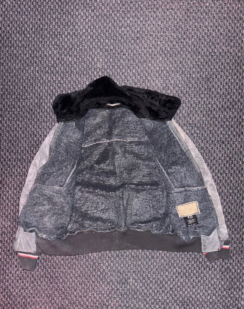 Suede Grey Faux Fur Bomber Jacket (Category: Coats, Jackets and Outerwear) located in Manila. Submitted by khloset (Listing ID 1400678040, Image 2). Description: Perfect for winter - - Grey jacket features a faux fur lining and collar for added warmth. It has a ribbed hem and cuffs with red and white stripes. The jacket has a zip closure and two front pockets..