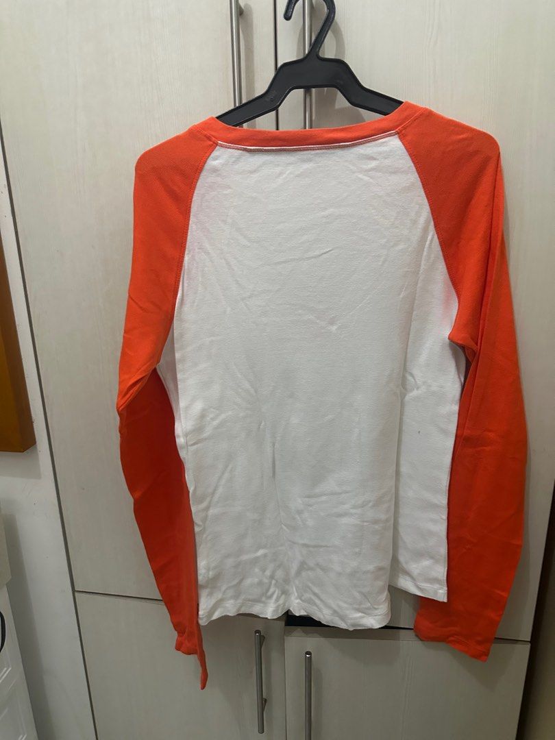 tommy hilfiger orange shirt (Category: Shirts) located in Quezon City. Submitted by cheemsspanda (Listing ID 1400694550, Image 2). Description: not sure if its real haha rfs: decluttering can meet up in katipunan.