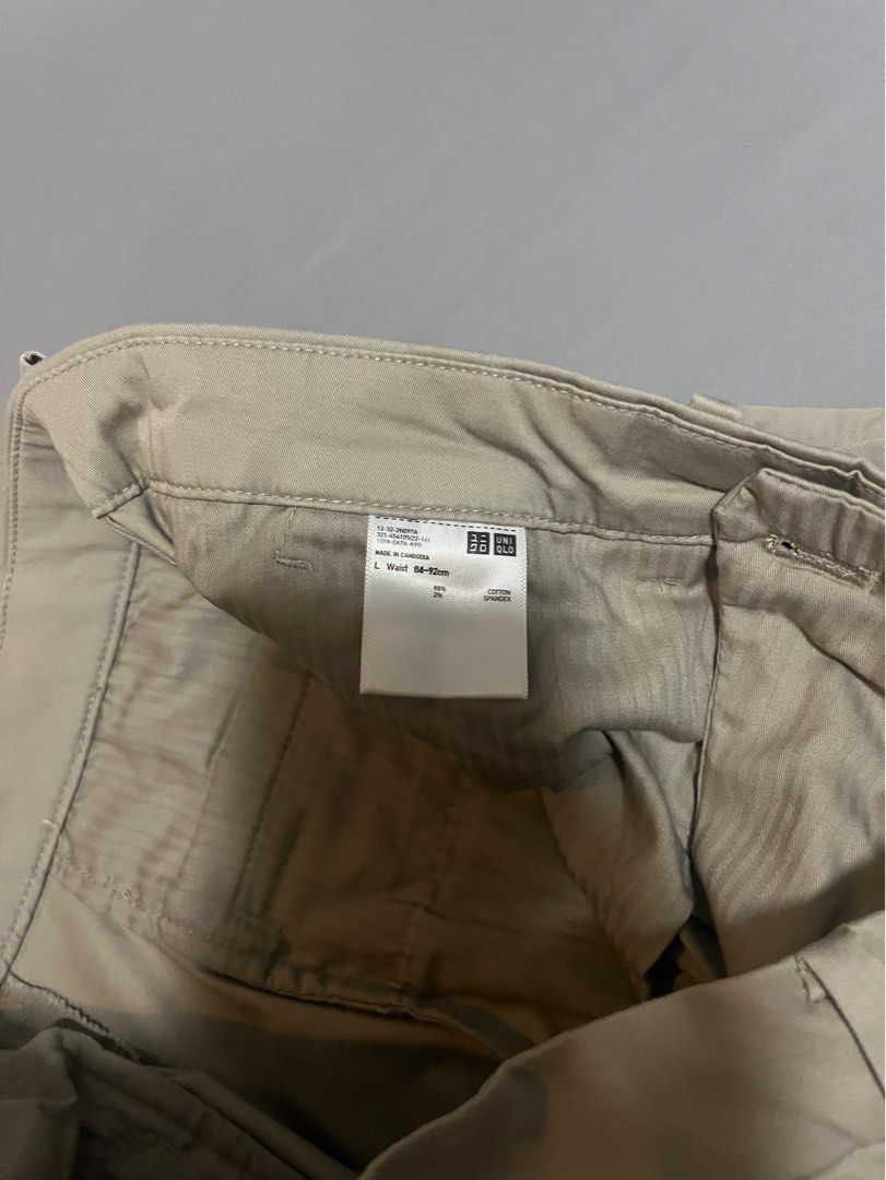 Uniqlo Beige Shorts - Size L (Category: Shorts) located in Tarlac. Submitted by johnjohnjohn23 (Listing ID 1400648245, Image 2). Description: Beige shorts from Uniqlo, size L. Waist measurement is 34-36 inches. The shorts have a classic design with a button and zipper closure. They feature two front pockets and a tailored fit. The inseam measures approximately 19 inches. Made in Cambodia..