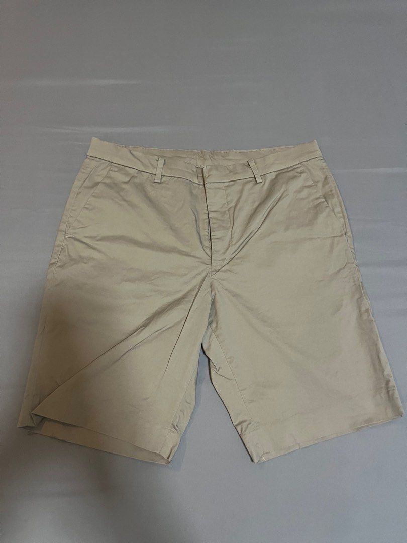 Uniqlo Beige Shorts - Size L (Category: Shorts) located in Tarlac. Submitted by johnjohnjohn23 (Listing ID 1400648245, Image 1). Description: Beige shorts from Uniqlo, size L. Waist measurement is 34-36 inches. The shorts have a classic design with a button and zipper closure. They feature two front pockets and a tailored fit. The inseam measures approximately 19 inches. Made in Cambodia..