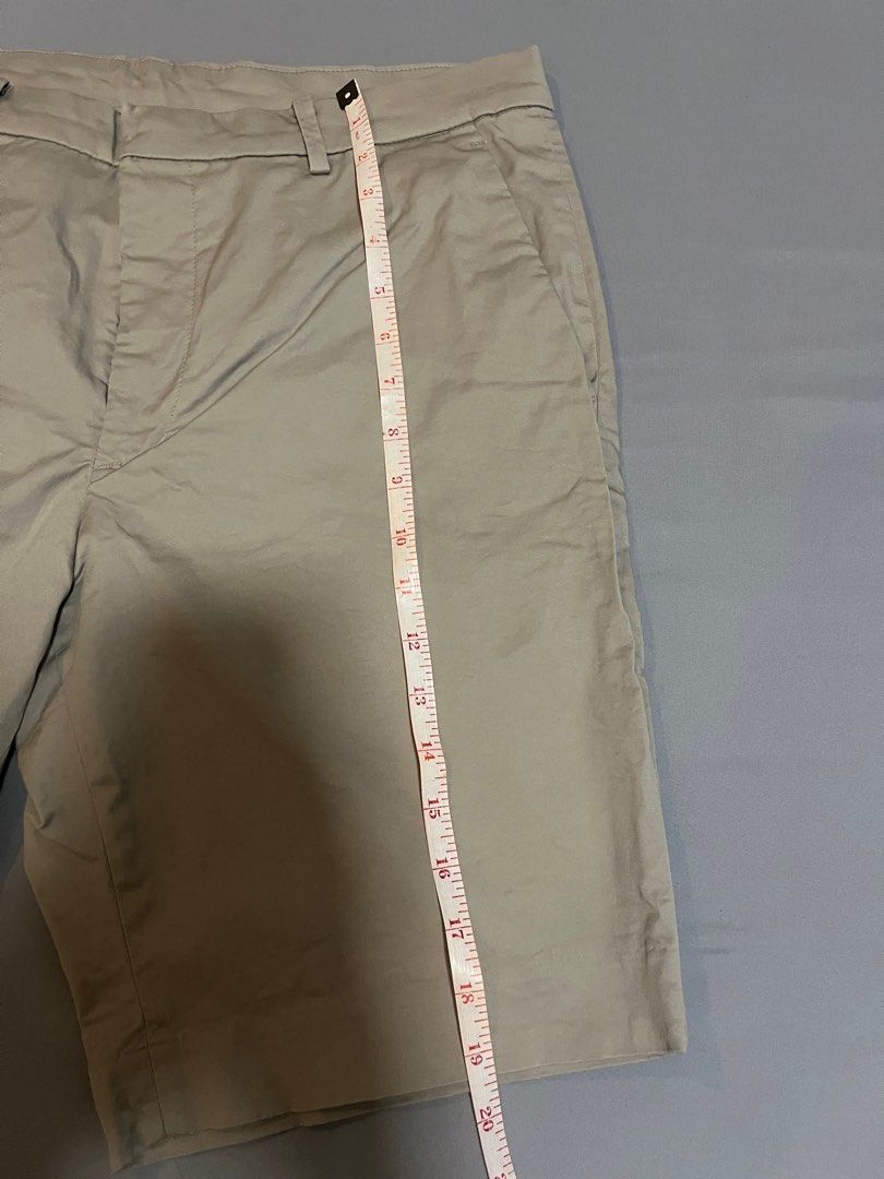 Uniqlo Beige Shorts - Size L (Category: Shorts) located in Tarlac. Submitted by johnjohnjohn23 (Listing ID 1400648245, Image 3). Description: Beige shorts from Uniqlo, size L. Waist measurement is 34-36 inches. The shorts have a classic design with a button and zipper closure. They feature two front pockets and a tailored fit. The inseam measures approximately 19 inches. Made in Cambodia..