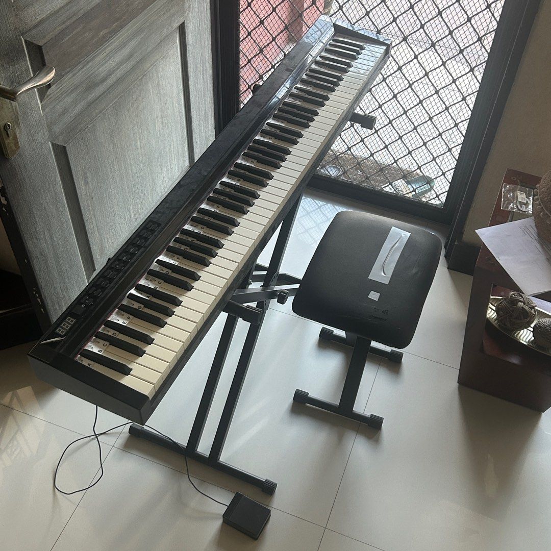 88-Key Digital Piano with Stand and Stool (Category: Musical Instruments) located in Pateros City. Submitted by mellamoroberto (Listing ID 1400946408, Image 1). Description: Used like new Comes with free Bag, Cover, stand, seat, guide, and sustain pedal 88 Electronic Keyboard (included the black keys) Tone: 129 tones Rhythms: 128 Rhythms Demo: 30 Demos Dual keyboard function Dynamics switch function Reset function LED display Sustain pedal, compl