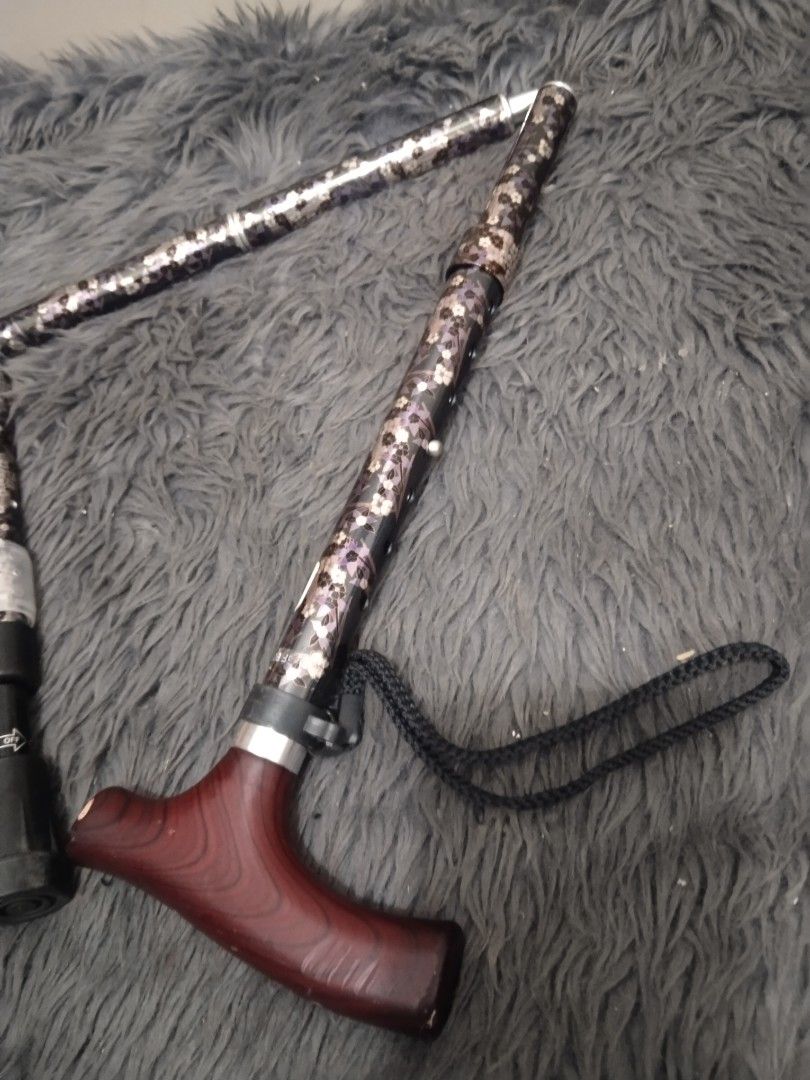 Affordable foldable walking cane/stick A😍👌 (Category: Medical Supplies & Tools) located in Malolos. Submitted by afford.japan (Listing ID 1400927511, Image 2). Description: - Adjustable walking cane - Patterned shaft - Comfortable wooden handle - Includes wrist strap - Foldable design - Rubber tip for stability - Dark brown handle finish.