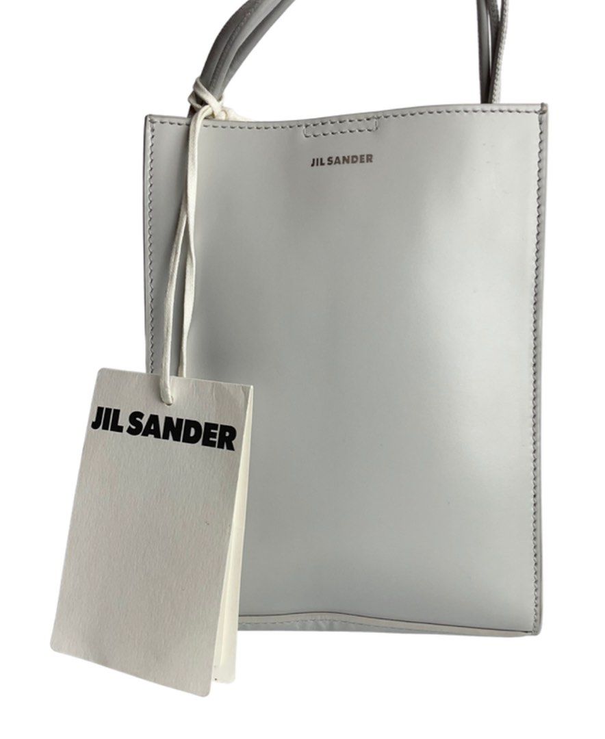 Auth Jil Sander bag (Category: Luxury Bags & Wallets) located in Caloocan City. Submitted by siftedthriftedph (Listing ID 1400851542, Image 1). Description: Jil Sander Tangle bag Light gray color, minimalist design Beautiful leather H-7.08in x L-5.51in.