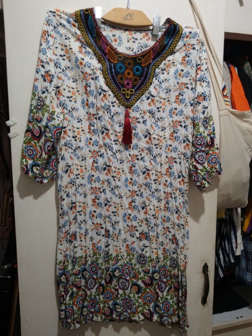 Challis Floral White Dress (Category: Dresses) located in Rizal. Submitted by rmrkshmc (Listing ID 1400875047, Image 2). Description: - Bohemian floral print dress - bust: 20" laid flat - length: 36" - Mid-lengrh sleeves - lightweight challis fabric - Detailed embroidered neckline with tassel - needs washing - Ideal for casual wear, beach outings, or relaxed days out - mop: gcash - loc: Mayamot, Antipolo .