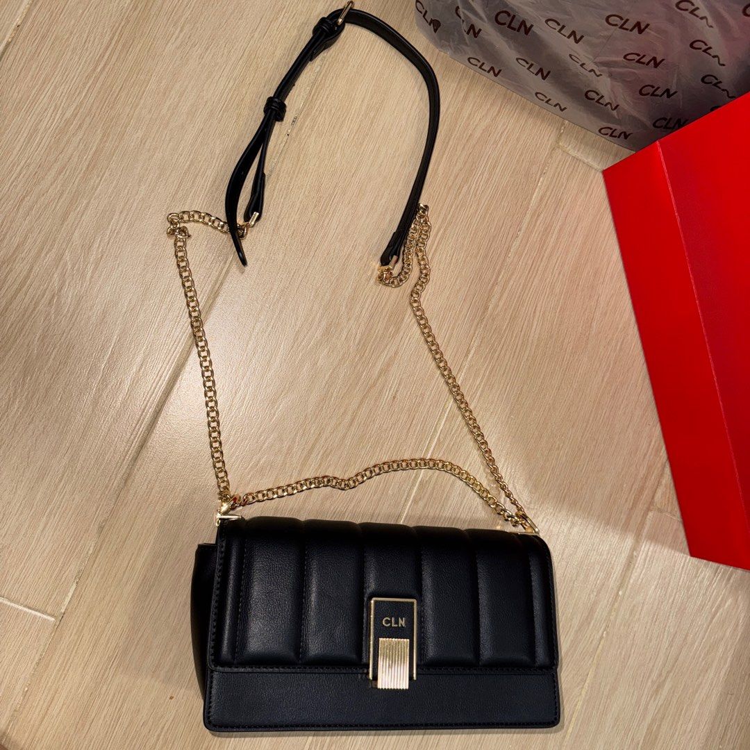SOLD! CLN Black 2 way bag Bag (Category: Shoulder Bags) located in Santa Maria. Submitted by grave.ty (Listing ID 1400927687, Image 3). Description: - CLN black shoulder or crossbody bag - LIKE NEW! AS IN! Used once for a wedding only. - Gold hardware - Adjustable Chain with Leather strap - Flap closure with CLN logo - Quilted design - Gold-tone clasp - Detachable strap - Zippered inner compartment - Comes complete with original paper bag eco bag