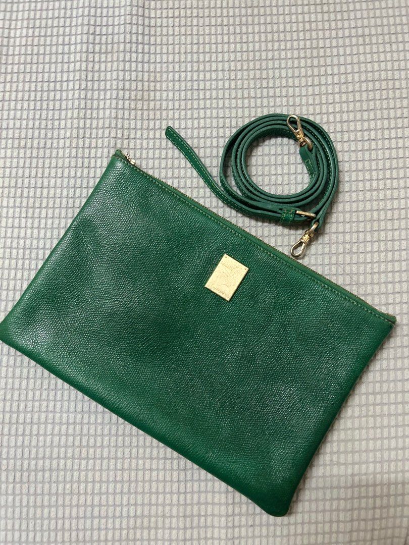 Couronne Green Clutch Bag with Strap (Category: Clutches) located in San Fernando. Submitted by lkdp888 (Listing ID 1400910112, Image 1). Description: Original Couronne envelope bag Rich green (rare color) Issues: zipper puller (you can just replace it) Normal signs of use.
