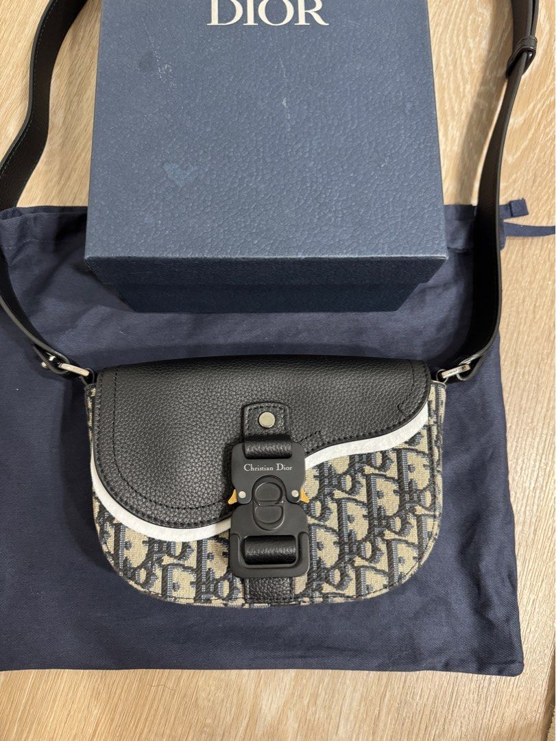 Dior Oblique Jacquard Mini Saddle Bag With Flap (Category: Luxury Bags & Wallets) located in Pasay City. Submitted by instinctiveph (Listing ID 1400918112, Image 1). Description: Used once and stored With dustbag, box, card and receipt Bought in US Dm me for more detailed pics.