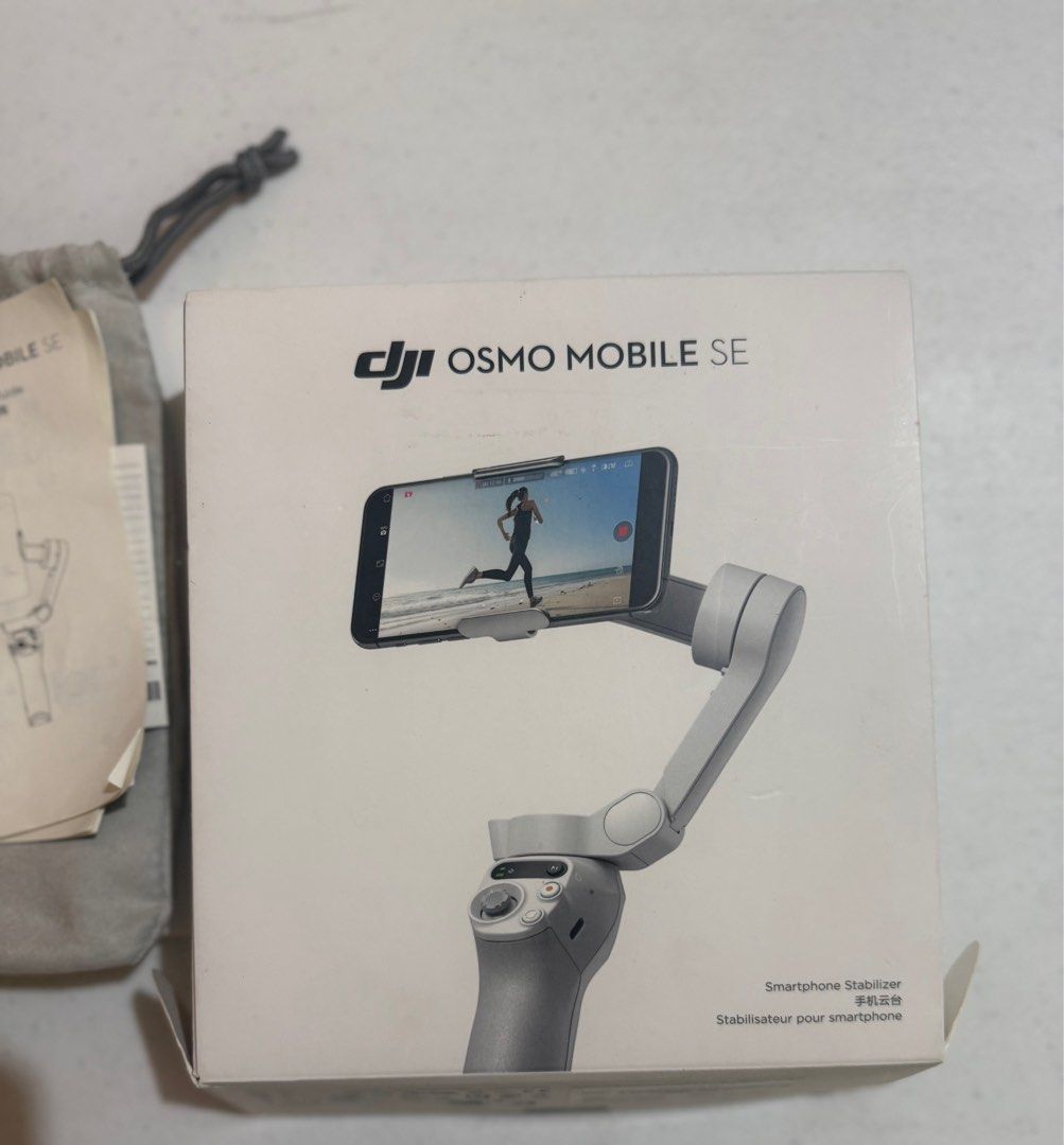 DJI Osmo Mobile SE Smartphone Stabilizer (Category: Gimbals & Stabilizers ) located in Quezon City. Submitted by preloved.declutter2024 (Listing ID 1400914764, Image 1). Description: - DJI Osmo Mobile SE smartphone stabilizer - Includes: stabilizer, tripod, phone clamp - Comes with original box, carrying pouch, and quick start guide - Color: Gray.