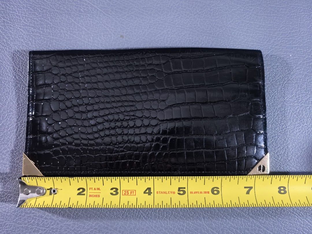 Dunhill Black Crocodile Wallet (Category: Luxury Bags & Wallets) located in Cagayan de Oro. Submitted by pootx (Listing ID 1400894745, Image 2). Description: - Dunhill black wallet - Crocodile skin pattern - Gold-toned corner accents - Multiple card slots - Dunhill logo visible - Made in England.