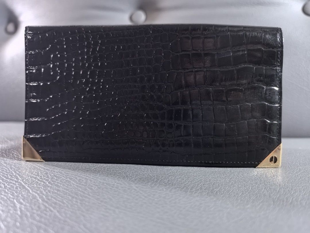 Dunhill Black Crocodile Wallet (Category: Luxury Bags & Wallets) located in Cagayan de Oro. Submitted by pootx (Listing ID 1400894745, Image 1). Description: - Dunhill black wallet - Crocodile skin pattern - Gold-toned corner accents - Multiple card slots - Dunhill logo visible - Made in England.