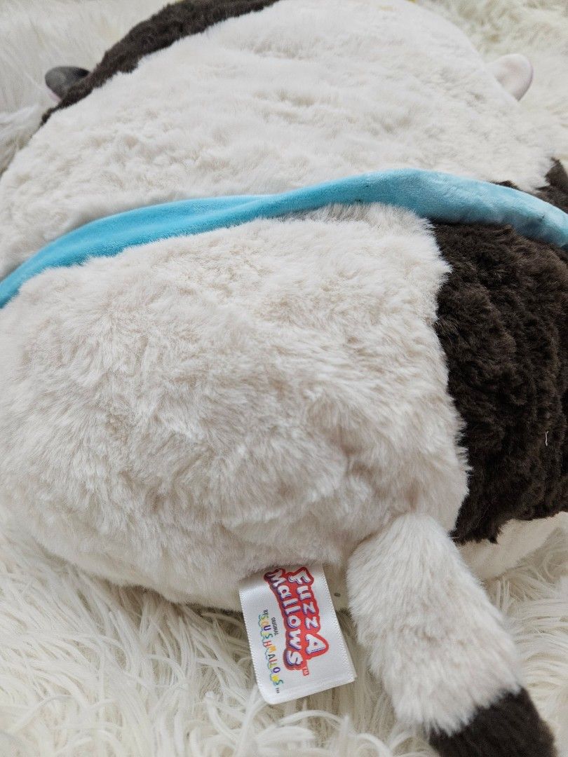 Fuzzamallows Connor the Cow Plush (Category: Plushies & Soft Toys) located in Taguig. Submitted by wonderworksbyjanele (Listing ID 1400958944, Image 2). Description: - Fuzzamallows Connor the Cow plush - Soft and fluffy texture - Black and white cow design - Includes a green pouch - Comes with original tag - Perfect for cuddling or display.