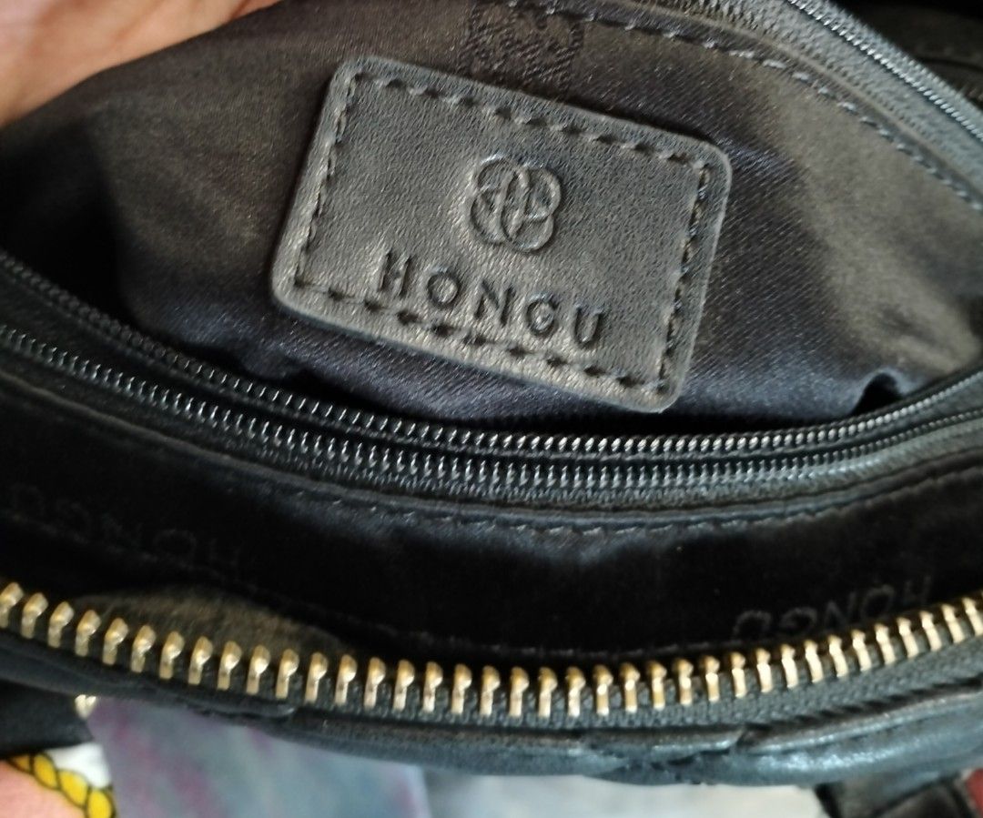Hongu Quilted Handbag with Scarf (Category: Luxury Bags & Wallets) located in Quezon City. Submitted by heavenleigh88qm (Listing ID 1400924845, Image 2). Description: - Hongu handbag 📌p280 📌preloved 📌handle with issue and placed twilly - Quilted design - Top handle - Detachable tassel - Decorative scarf - Zipper closure - Small logo on front - Lined interior 📌mop:gcash and Maya 📌shipping shouldered by buyer jnt , grab, lalamove, lbc.