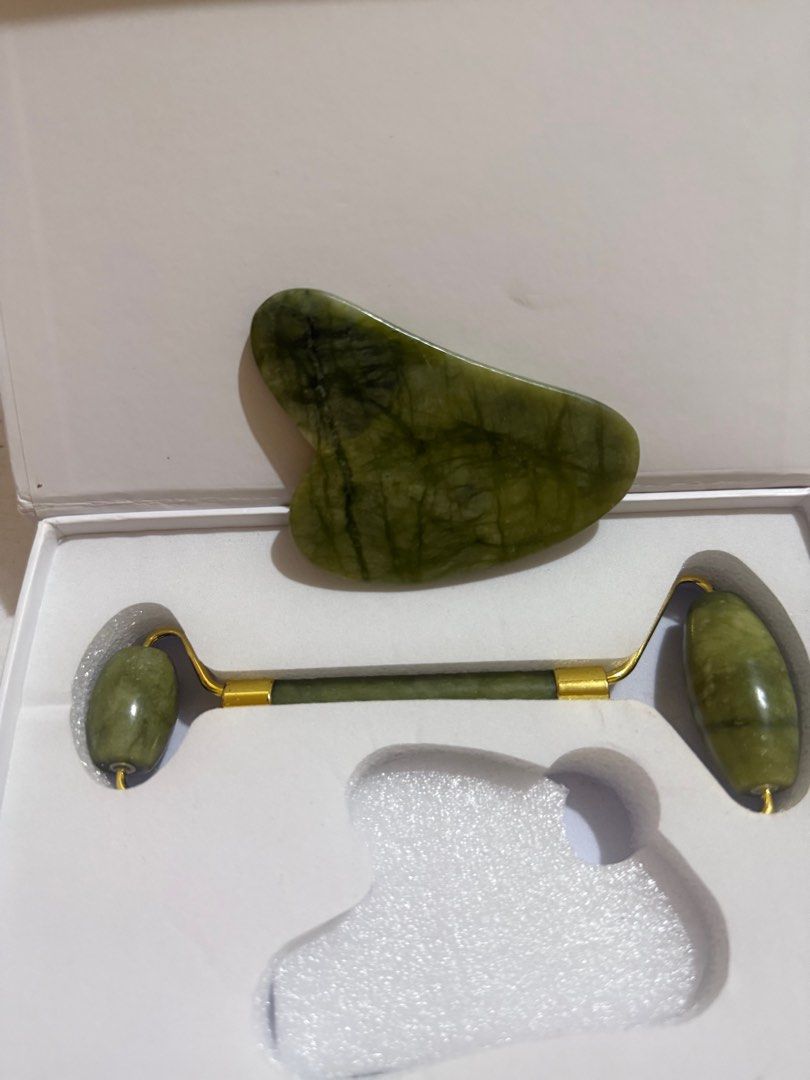 Jade Roller and Gua Sha Set (Category: Face Care) located in Quezon City. Submitted by preloved.declutter2024 (Listing ID 1400914877, Image 2). Description: - Jade facial roller with gold handle - Gua sha tool included - Made of green jade - Comes in a white box with custom cutouts - Ideal for facial massage and skincare routines.