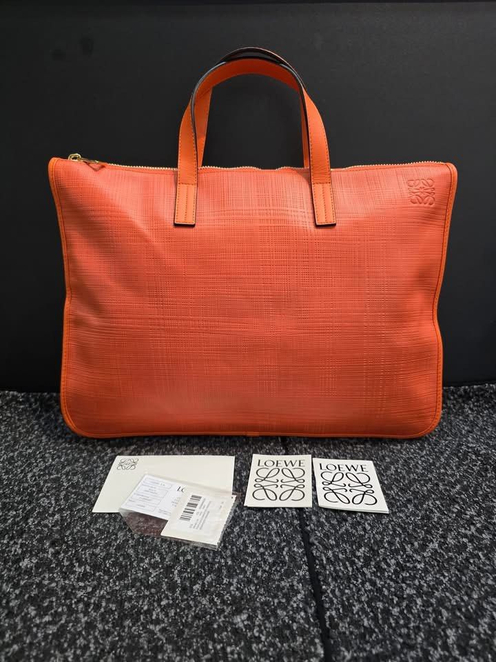 Loewe Orange Briefcase (Category: Luxury Bags & Wallets) located in General Santos City (Dadiangas). Submitted by braverabbit.67 (Listing ID 1400960017, Image 1). Description: 💯MONEY BACK GUARANTEE 💯💯👌🏻 Loewe Document bag in verygood condition medium 𝗦𝘂𝗿𝗲 𝗯𝘂𝘆𝗲𝗿 𝗺𝗮𝘆 𝗿𝗲𝗾𝘂𝗲𝗦𝘁 𝗺𝗼𝗿𝗲 𝗱𝗲𝘁𝗮𝗶𝗹𝗲𝗱 𝗽𝗶𝗰𝗦 𝗼𝗿 𝘃𝗲𝗱𝗶𝗼! ‼️𝗙𝗢𝗥 𝗔𝗦𝗔𝗣 𝗥𝗘𝗣𝗟𝗬 𝗠𝗘𝗦𝗦𝗔𝗚𝗘 𝗨𝗦 𝗢𝗡 𝗙𝗔𝗖𝗘𝗕𝗢𝗢𝗞 NAME: LAPUZ OERLIE with Profi