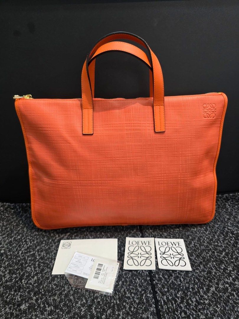 Loewe Orange Briefcase (Category: Luxury Bags & Wallets) located in General Santos City (Dadiangas). Submitted by braverabbit.67 (Listing ID 1400960017, Image 2). Description: 💯MONEY BACK GUARANTEE 💯💯👌🏻 Loewe Document bag in verygood condition medium 𝗦𝘂𝗿𝗲 𝗯𝘂𝘆𝗲𝗿 𝗺𝗮𝘆 𝗿𝗲𝗾𝘂𝗲𝗦𝘁 𝗺𝗼𝗿𝗲 𝗱𝗲𝘁𝗮𝗶𝗹𝗲𝗱 𝗽𝗶𝗰𝗦 𝗼𝗿 𝘃𝗲𝗱𝗶𝗼! ‼️𝗙𝗢𝗥 𝗔𝗦𝗔𝗣 𝗥𝗘𝗣𝗟𝗬 𝗠𝗘𝗦𝗦𝗔𝗚𝗘 𝗨𝗦 𝗢𝗡 𝗙𝗔𝗖𝗘𝗕𝗢𝗢𝗞 NAME: LAPUZ OERLIE with Profi