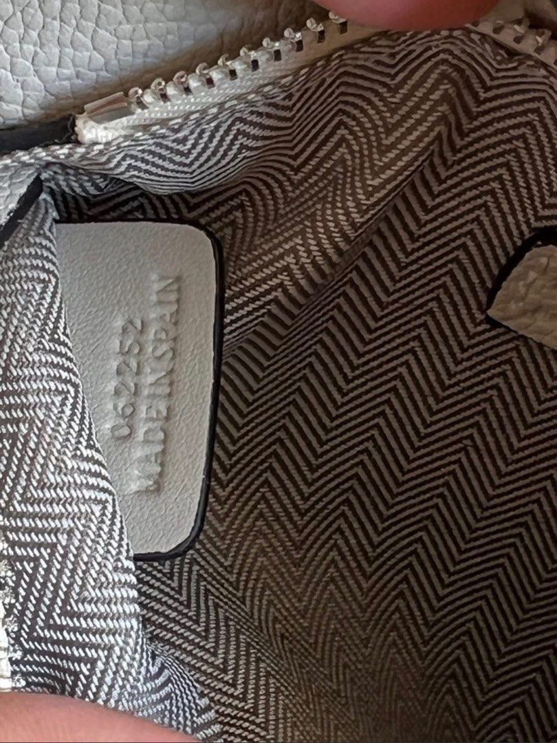 Loewe Puzzle Mini Bag (with box) (Category: Luxury Bags & Wallets) located in Taytay. Submitted by darkswan016 (Listing ID 1400826193, Image 3). Description: Bought this from carousell 2 months ago. Rfs: too small for me. Cannot guarantee authenticity. - Loewe Puzzle Mini Bag - Light grey color - Unique geometric design - Top handle and detachable shoulder strap - Interior with herringbone lining - Made in Spain.