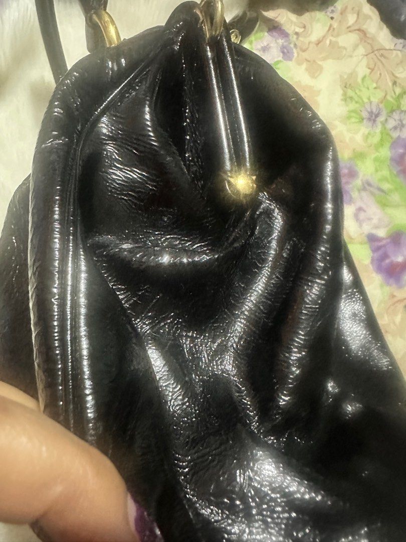 AUTHENTIC Marc Jacobs stam bag (Category: Luxury Bags & Wallets) located in Paranaque City. Submitted by love1927 (Listing ID 1400796090, Image 3). Description: Up for grabs is my AUTHENTIC MARC JACOBS BAG Released in 2005, this Marc Jacobs design has a black exterior crafted from patent leather and enhanced with gold-tone hardware. This elegant Stam bag features a kiss-lock top closure that opens to a satin interior, dual top handles, and a remo