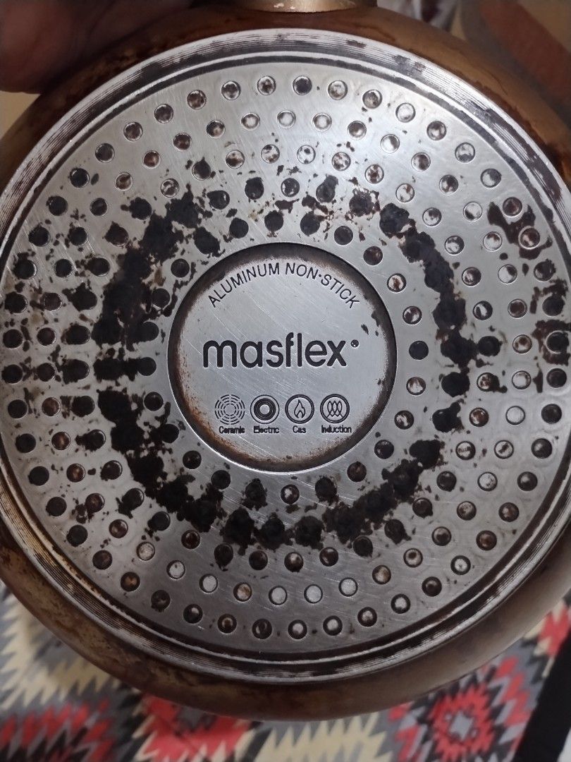 Masflex Aluminum Non-Stick Frying Pan (Category: Cookware & Accessories) located in Makati City. Submitted by chamarket.2022 (Listing ID 1400799364, Image 3). Description: - Masflex non-stick frying pan - 9-inch diameter - Brown exterior - Silver base with Masflex logo - Suitable for electric and gas stoves - Matching handle.