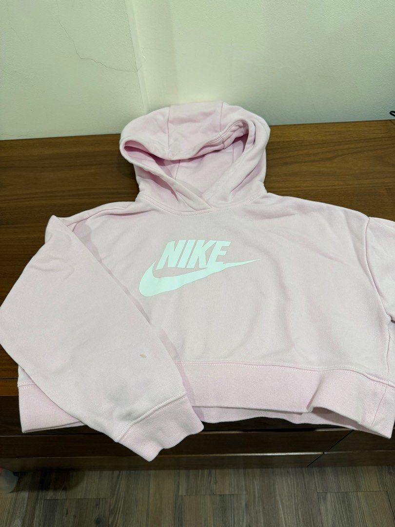 Nike Cropped Hoodie - Pink (Category: Babies & Kids Fashion) located in Quezon City. Submitted by declutterinclutter (Listing ID 1400869473, Image 1). Description: - Pink Nike cropped hoodie - Size: S - Features Nike logo - Made in Cambodia - Minor stains on sleeves - Hooded - Ribbed hem and cuffs.