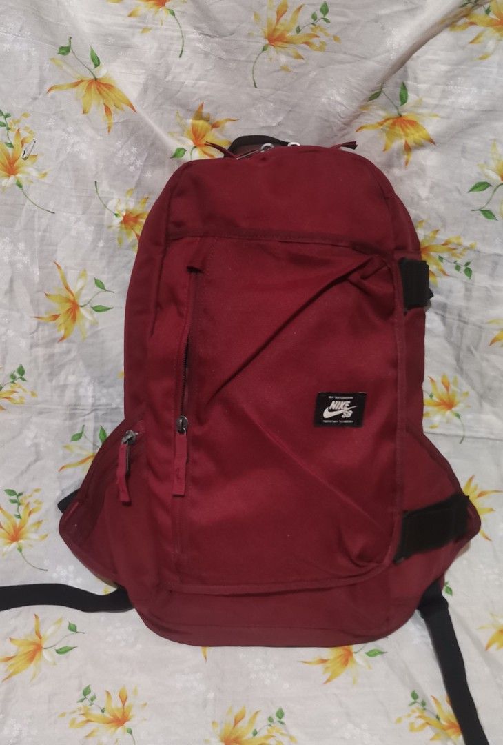 NIKE SB dark red nylon backpack bag (Category: Backpacks) located in Baguio. Submitted by blossombeauty.chicfinds23 (Listing ID 1400855901, Image 1). Description: Like new condition. With sling Plus shipping.