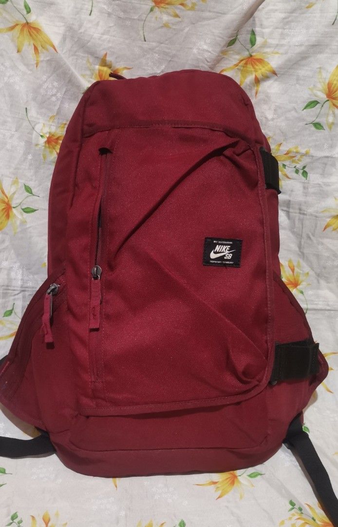 NIKE SB dark red nylon backpack bag (Category: Backpacks) located in Baguio. Submitted by blossombeauty.chicfinds23 (Listing ID 1400855901, Image 2). Description: Like new condition. With sling Plus shipping.