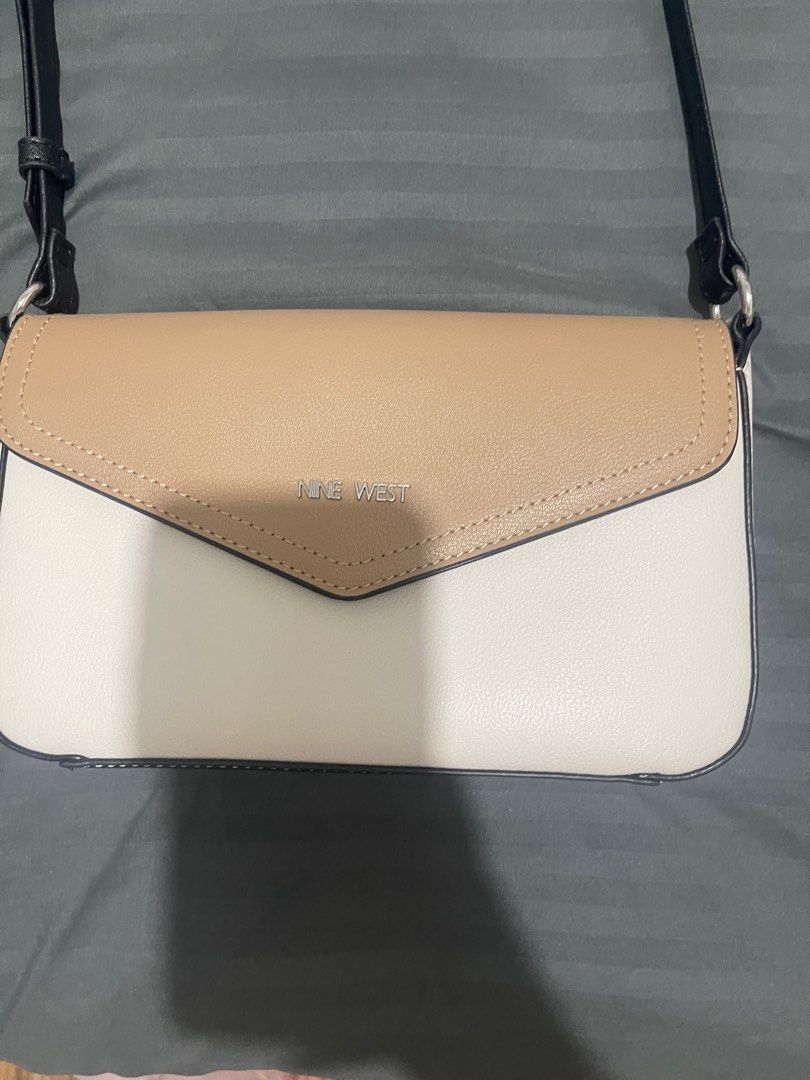Nine West Bowie Mini Flap Crossbody (Category: Cross-body Bags) located in Las Pinas. Submitted by chelfabs (Listing ID 1400799853, Image 3). Description: The Bowie Flap Crossbody is a core item with a magnetic flap closure, card slots on back wall, and an adjustable crossbody strap to wear long or short..