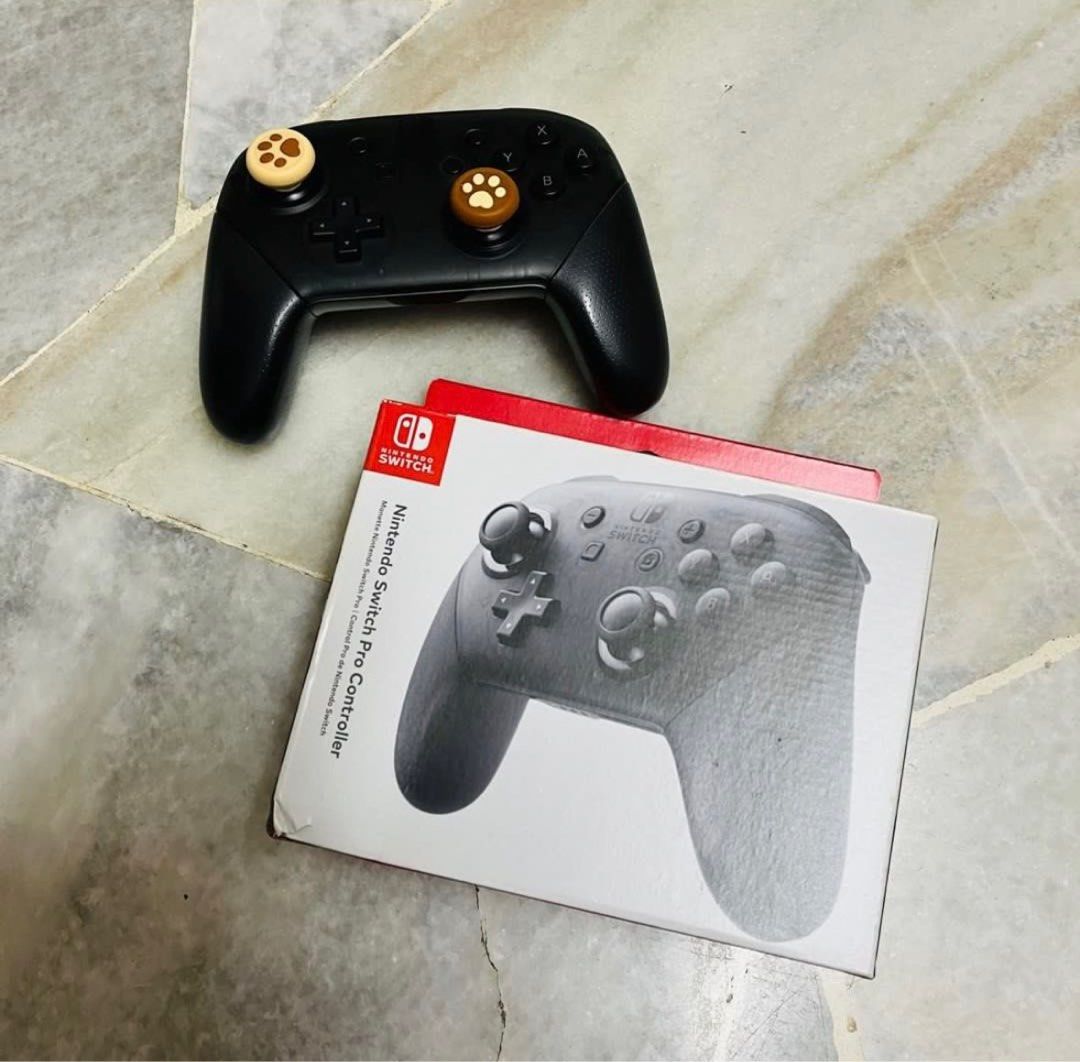 Nintendo Switch Pro Controller (Category: Controllers) located in Rawang. Submitted by pinkylg (Listing ID 1400915315, Image 3). Description: Genuine product with boxes. Condition: 60% Good The controller has scratches at the head, all buttons are working well. There is a minor problem with the controller: there is sometimes drifts. Without type c cable. Price negotiable, don’t hesitate text me for more details..
